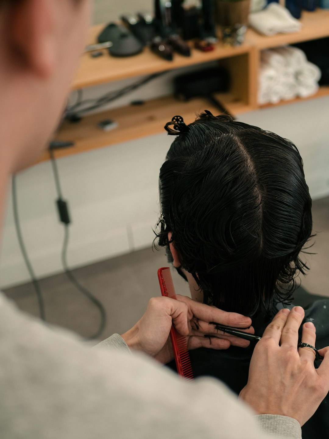 Stylist working with client